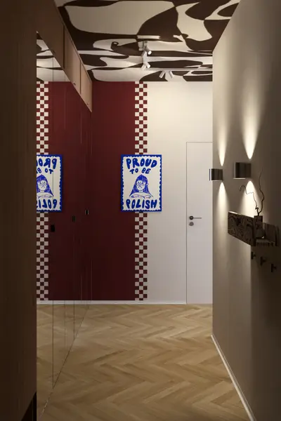 Przedpokój z bordową szafą i wzorzystym sufitem
