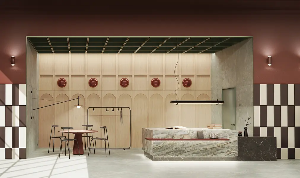 Widok ogólny przestrzeni showroom z marmurową ladą, drewnianą ścianą z arkadami i szachownicowymi płytkami